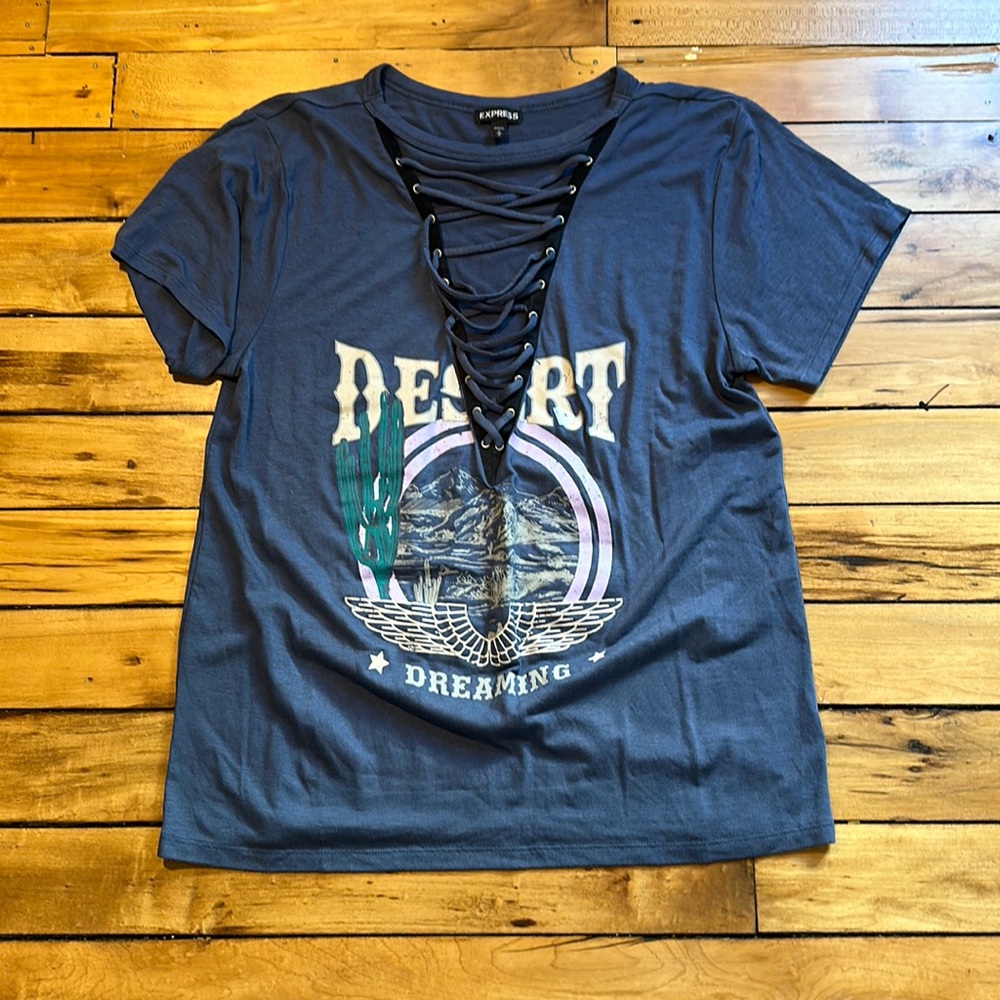 Express relaxed fit tee with lace up neck.